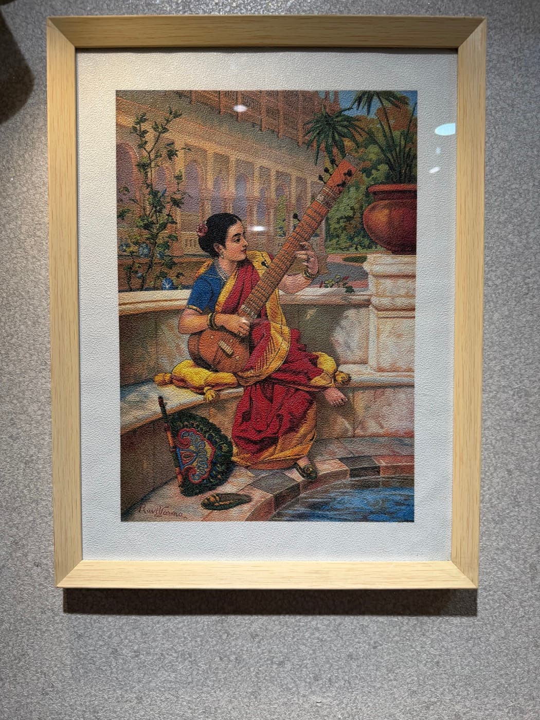 Natural wood picture frame with white mat and classical Indian art print—premium profiles for décor and photo retail
